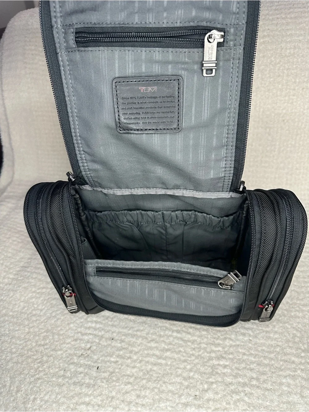 Tumi Black Toiletry Bag with Red Accents